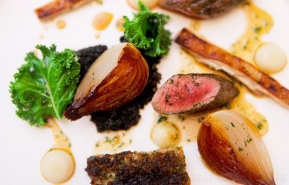 Fillet, shoulder and belly of Welsh lamb with kale compote, glazed Roscoff onion and lamb jus