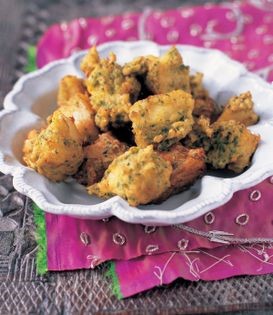 Fillets of fish coated in green spice paste