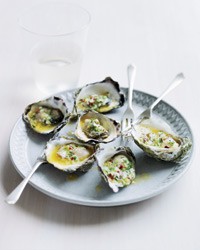 Fire-grilled oysters with green garlic and pastis butter