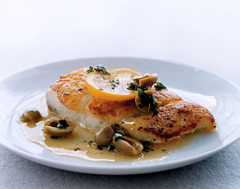 Fish fillets with olives and oregano