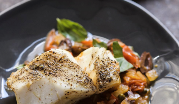 Fish poached in spicy tomato-garlic broth (Pesce all'acqua pazza)