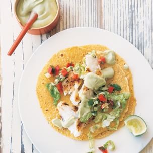 Fish tacos with cabbage slaw and avocado crema
