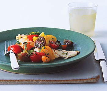 Fish with curried cucumber tomato water and tomato herb salad