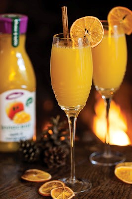 Five gold rings mocktail (warmed and spiced apple and mango juice mocktail)