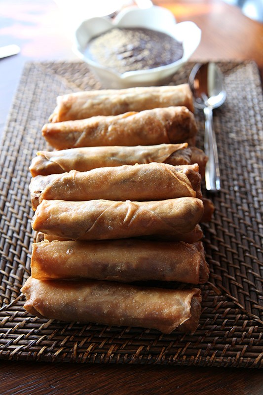 Five-spice duck confit spring rolls with soy-sour cherry compote
