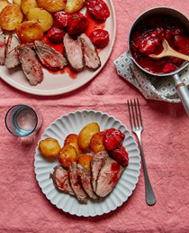 Five-spice duck with roast plums and crisp potatoes