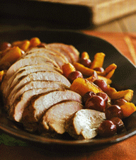 Five-spice pork tenderloin with pumpkin half-moons and red grapes