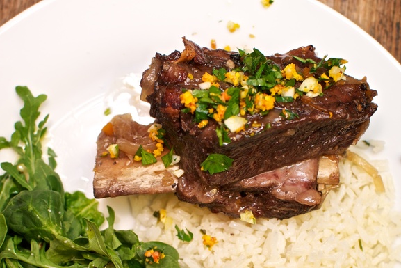 Flambeed short ribs with blood orange gremolata