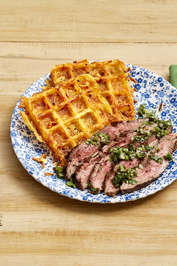Flank steak with cheesy waffle hash browns