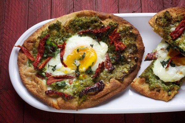 Flatbread pizzas with broccoli pesto, sun-dried tomato and egg
