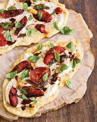 Flatbread with tomatoes, ricotta and anchovies