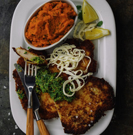 Flattened chicken paillards with green garlic-parsley pesto and carrot-cilantro mash