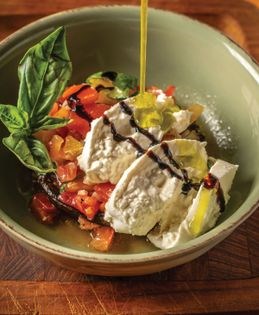 Flavorful black bean burgers in pita pockets with hummus and ajvar