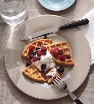 Flaxseed waffles with berries and honey cream