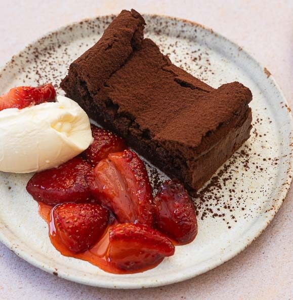Flourless chocolate cake with roasted strawberries