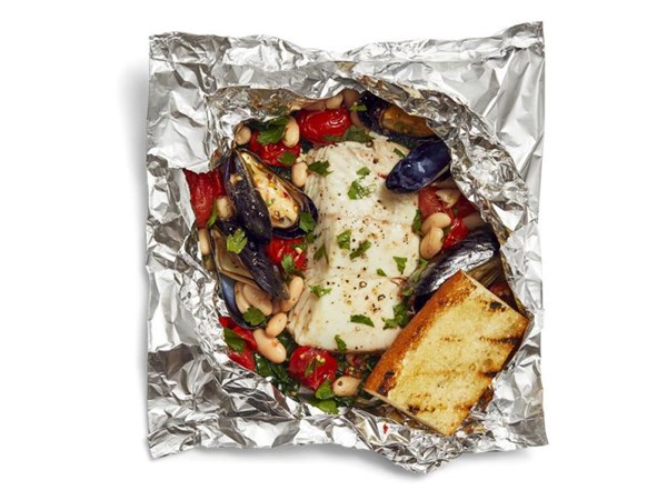 Foil-packet seafood with beans and kale