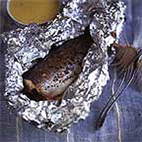 Foil-wrapped baked sea bass with beurre blanc 