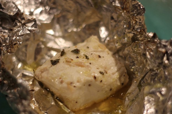 Foil wrapped halibut with garlic, oregano & lemon