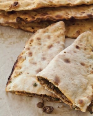 Folded flatbread with a meat & olive filling (Zeytin böreği)