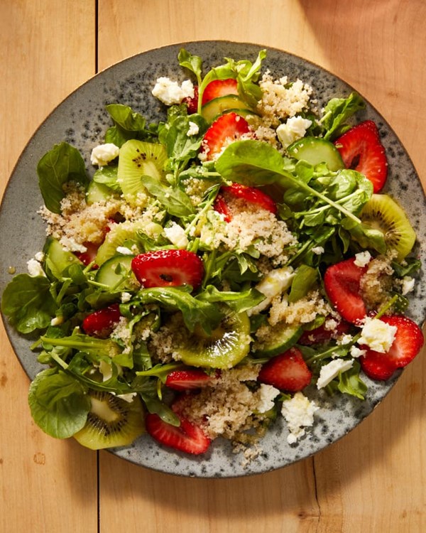Fonio and strawberry salad with peppery greens