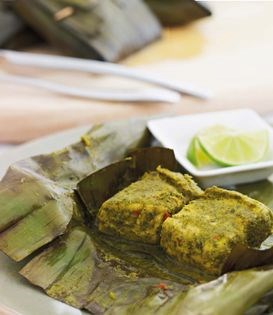 Fragrant coconut fish in banana leaves