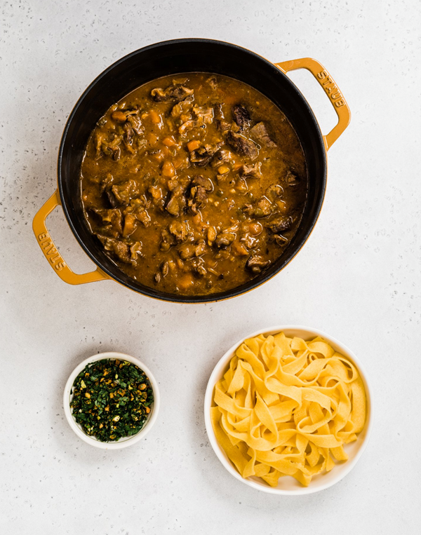Fragrant lamb ragú with dates, honeynut squash, pappardelle and pistachio gremolata