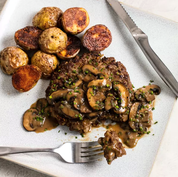 French onion hamburgers steaks with potatoes and gravy