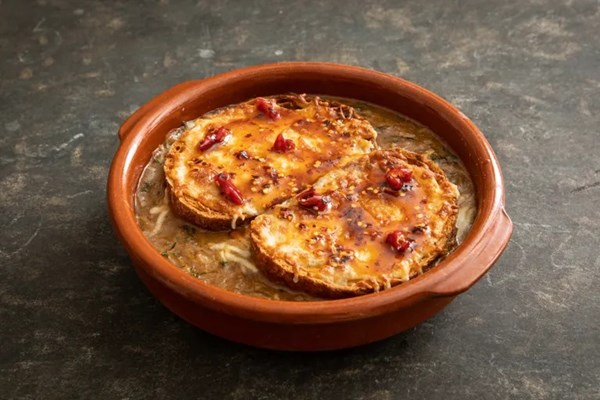 French onion soup with miso, Gruyère and hot honey