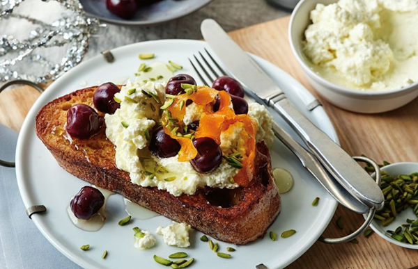 French toast with cherries, orange syrup and ricotta