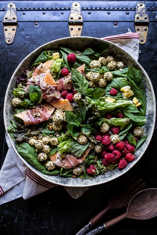 Fresh basil salad with prosciutto wrapped melon and toasted seed rolled goat cheese