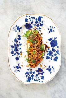 Fresh chèvre tartine with shredded carrots, currants, and dukkah