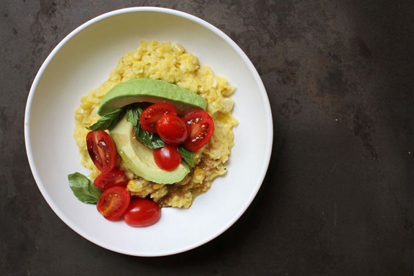 Fresh corn polenta with avocado and tomato salad