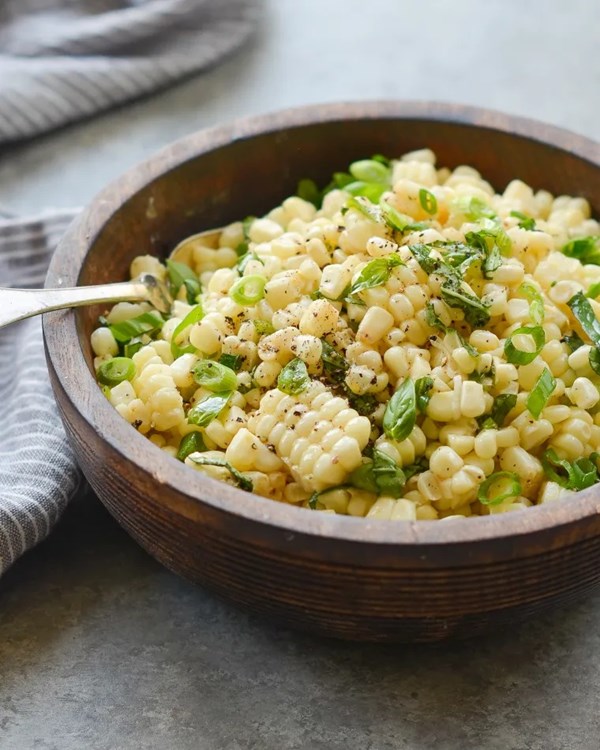 Fresh corn salad with scallions and basil
