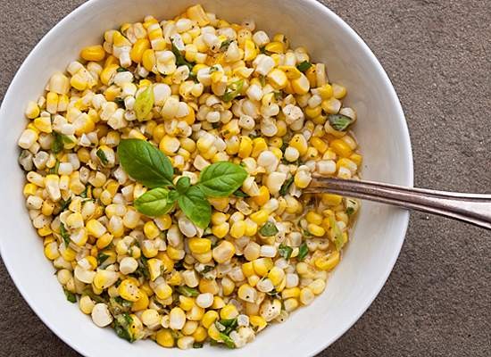 Fresh corn salad with scallions and basil