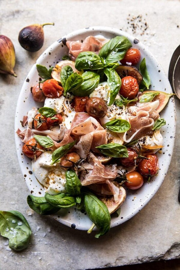 Fresh fig, prosciutto, and arugula salad with cherry tomato vinaigrette