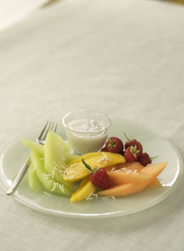 Fresh fruit plate with kaffir lime leaf and coconut syrup