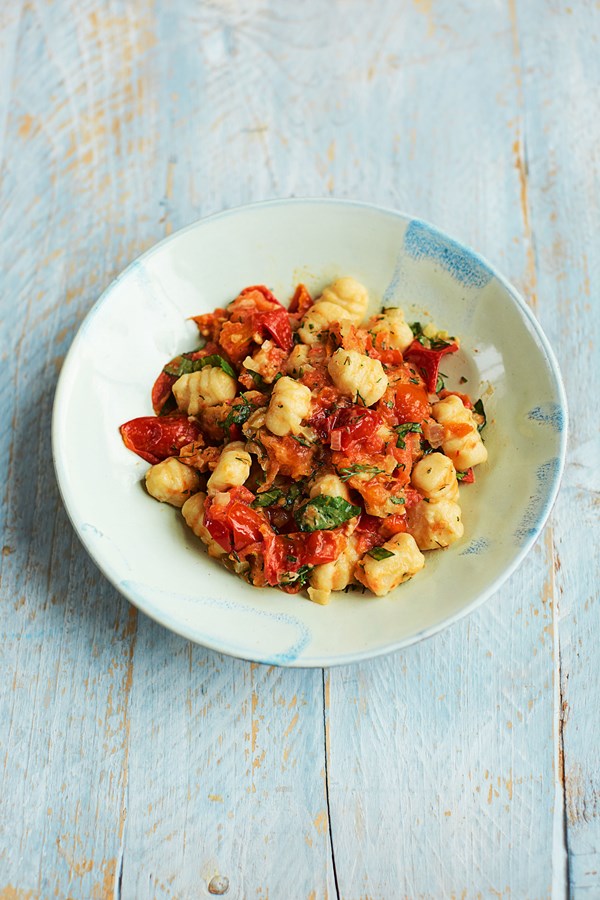 Fresh gnocchi with tomatoes and summer herbs