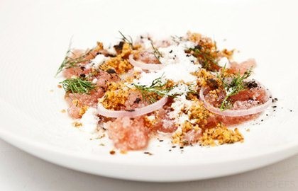 Fresh lumpfish roe with crispy chicken skin, onions and cream