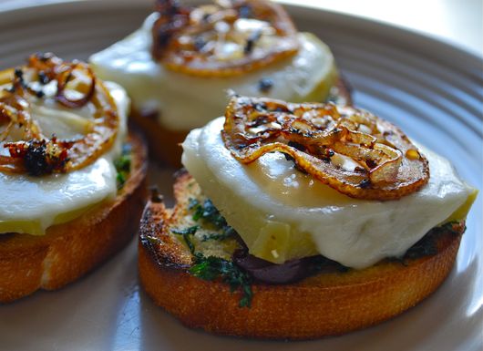 Fresh mozzarella and roasted kohlrabi crostini with crispy lemons and shallots