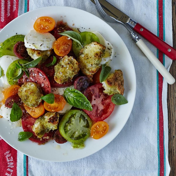 Fresh mozzarella tomato salad with torn pesto croutons