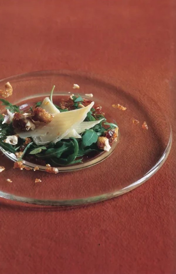Fresh pear, Manchego, and arugula salad with caramelized walnuts and warm, walnut-liqueur vinaigrette