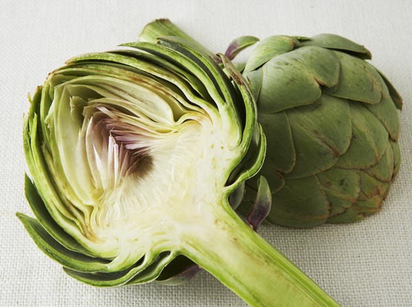 Fresh slow-baked artichoke quarters with minted crumbs