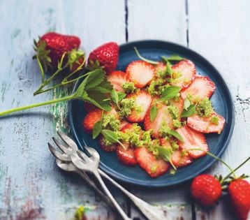 Fresh strawberry carpaccio with aromatic herb sugar