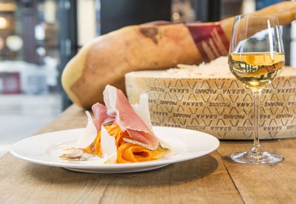 Fresh tagliolini with Grana Padano, prosciutto, and truffle