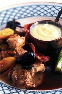 Fricassée of local pheasant with Ampleforth apples, young leeks, prunes and cider cream, celeriac purée