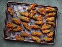 Fried anchovy-stuffed zucchini blossoms