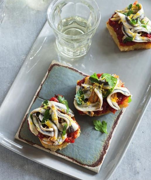 Fried bread and red pepper jam with white anchovies