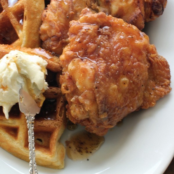 Fried chicken and buttermilk waffles with black pepper maple syrup and whipped vanilla butter