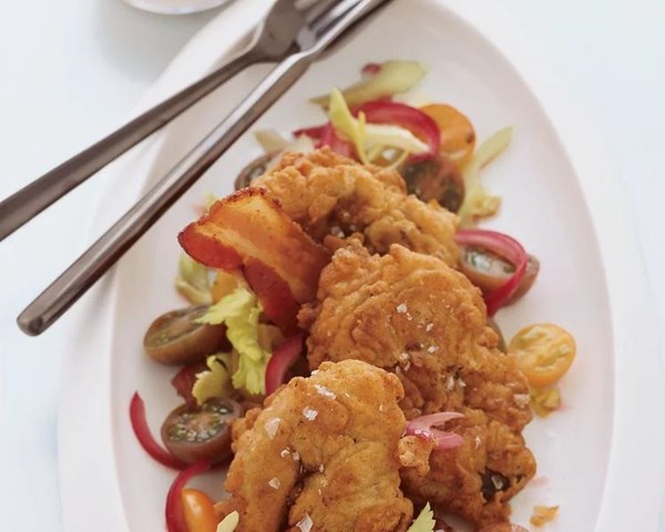 Fried chicken liver, bacon and tomato salad with ranch dressing
