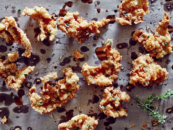 Fried chicken skin with hot sauce and honey